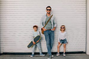 Portrait of a young father and his two children